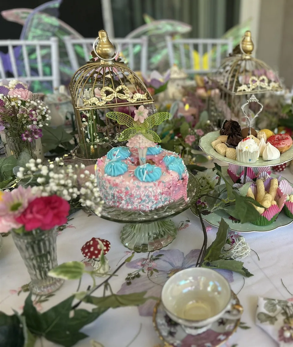Fairy birthday cake and a table of tea-party sweets